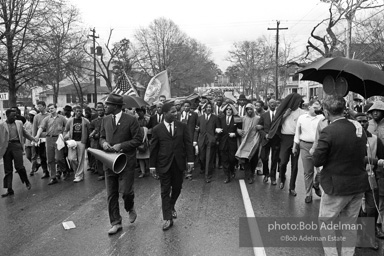 Dr. King leads a protest march around the state capital in Montgomery Alabama protesting the treatment of black demonstrators and voter applicants in Selma, Alabama prior to the Selma to Montgomery march. Montgomery, Alabama. 1965.