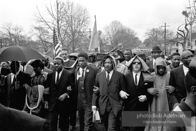 Dr. King leads a protest march around the state capital in Montgomery Alabama protesting the treatment of black demonstrators and voter applicants in Selma, Alabama prior to the Selma to Montgomery march. Montgomery, Alabama. 1965.