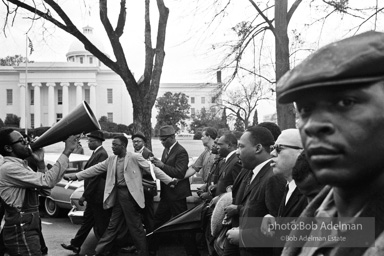 Dr. King leads a protest march around the state capital in Montgomery Alabama protesting the treatment of black demonstrators and voter applicants in Selma, Alabama prior to the Selma to Montgomery march. Montgomery, Alabama. 1965.
