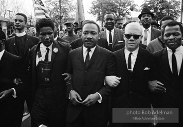 Dr. King leads a protest march around the state capital in Montgomery Alabama protesting the treatment of black demonstrators and voter applicants in Selma, Alabama prior to the Selma to Montgomery march. Montgomery, Alabama. 1965.