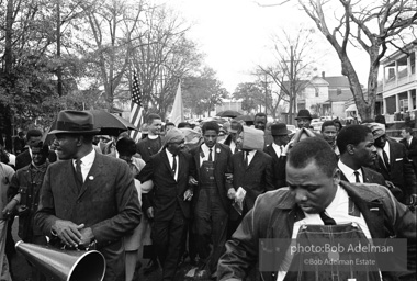 Dr. King leads a protest march around the state capital in Montgomery Alabama protesting the treatment of black demonstrators and voter applicants in Selma, Alabama prior to the Selma to Montgomery march. Montgomery, Alabama. 1965.