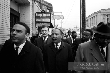 A triumphant King leaves the federal courthouse  after a federal judge, Frank Johnson, rules that the Selma-to-Montgomery march can proceed, Montgomery,  Alabama.  1965