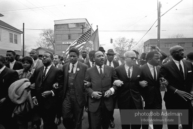 Dr. King leads a protest march around the state capital in Montgomery Alabama protesting the treatment of black demonstrators and voter applicants in Selma, Alabama prior to the Selma to Montgomery march. Montgomery, Alabama. 1965.