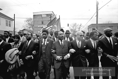 Dr. King leads a protest march around the state capital in Montgomery Alabama protesting the treatment of black demonstrators and voter applicants in Selma, Alabama prior to the Selma to Montgomery march. Montgomery, Alabama. 1965.