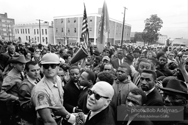 Dr. King leads a protest march around the state capital in Montgomery Alabama protesting the treatment of black demonstrators and voter applicants in Selma, Alabama prior to the Selma to Montgomery march. Montgomery, Alabama. 1965.