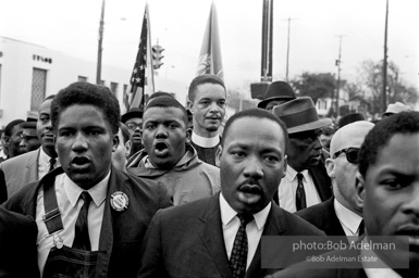 Dr. King leads a protest march around the state capital in Montgomery Alabama protesting the treatment of black demonstrators and voter applicants in Selma, Alabama prior to the Selma to Montgomery march. Montgomery, Alabama. 1965.