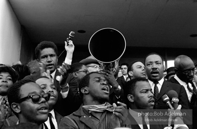 Rev. Abernathy speaking in front of Selma city hall protesting the denial of the right to vote to black citizens of Selma, Alabama. 1965