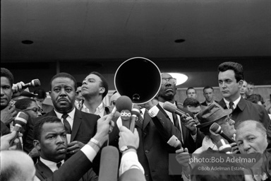 Martin Luther King speaking in front of Selma city hall protesting the denial of the right to vote to black citizens of Selma, Alabama. 1965