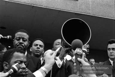 Martin Luther King speaking in front of Selma city hall protesting the denial of the right to vote to black citizens of Selma, Alabama. 1965