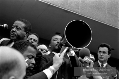 Martin Luther King speaking in front of Selma city hall protesting the denial of the right to vote to black citizens of Selma, Alabama. 1965