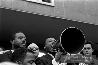 Martin Luther King speaking in front of Selma city hall protesting the denial of the right to vote to black citizens of Selma, Alabama. 1965