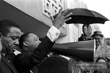 Martin Luther King speaking in front of Selma city hall protesting the denial of the right to vote to black citizens of Selma, Alabama. 1965