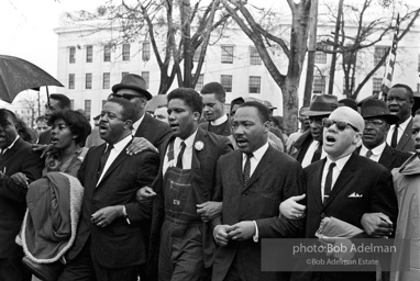 Dr. King leads a protest march around the state capital in Montgomery Alabama protesting the treatment of black demonstrators and voter applicants in Selma, Alabama prior to the Selma to Montgomery march. Montgomery, Alabama. 1965.