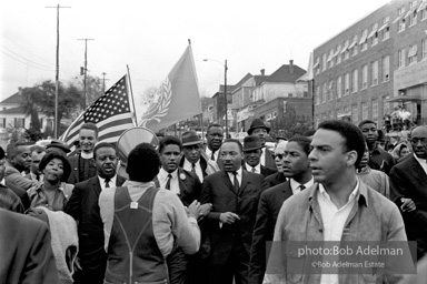 Dr. King leads a protest march around the state capital in Montgomery Alabama protesting the treatment of black demonstrators and voter applicants in Selma, Alabama prior to the Selma to Montgomery march. Montgomery, Alabama. 1965.