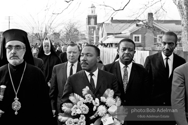 Dr. King carrying a wreath, leads a memorial march for civil-rights crusader, Rev. James Reeb.Selma, Alabama. 1965