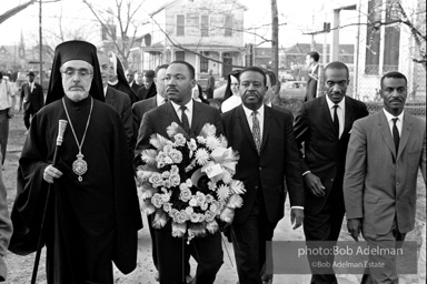 Dr. King carrying a wreath, leads a memorial march for civil-rights crusader, Rev. James Reeb.Selma, Alabama. 1965