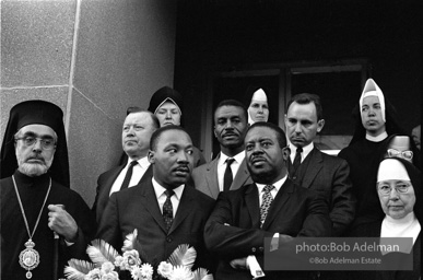 Dr. King carrying a wreath, leads a memorial march for civil-rights crusader, Rev. James Reeb.Selma, Alabama. 1965