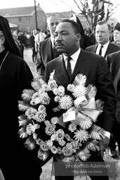 Dr. King carrying a wreath, leads a memorial march for civil-rights crusader, Rev. James Reeb.Selma, Alabama. 1965