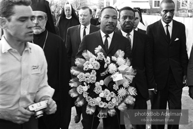 Dr. King carrying a wreath, leads a memorial march for civil-rights crusader, Rev. James Reeb.Selma, Alabama. 1965