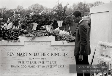 King’s tombstone on view near Morehouse College, Atlanta 1968. King’s tombstone was placed on view on the grounds of Morehouse College at the time of the memorial service.
It was subsequently placed over his grave at South View Cemetery in Atlanta, then moved in 1977 when King’s remains were re-interred at the Martin Luther King, Jr. National Historic Site near downtown Atlanta.