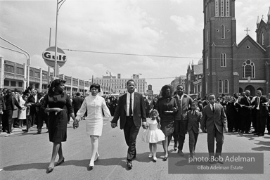 The King family leads the mourners march through the streets of Atlanta  to begin Martin Luther King's funeral