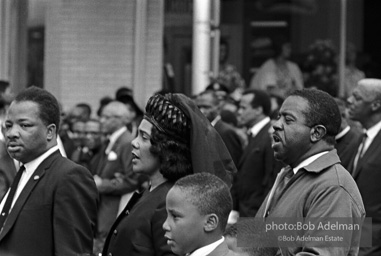 The King family leads the mourners march through the streets of Atlanta  to begin Martin Luther King's funeral