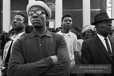 Spectators view Martin Luther King's funeral procession. Atlanta, GA. 1968