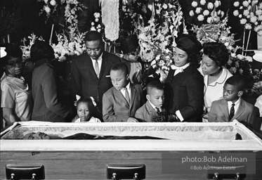 Members of KingÕs family, including his wife and children, view his body as it lies in state,  Atlanta, Georgia.  1968-


ÒThe King family had had to share him with the world all his life, and now he was finally home. He once voiced how he wished to be remembered and those words resonated at his funeral. ÔIÕd like someone to mention that I tried to be right on the war question É that I did try to feed the hungry É that I did try, in my life, to clothe those who were naked É that I did try, in
my life, to visit those who were in prison É that I tried to love and serve humanity.ÕÓ