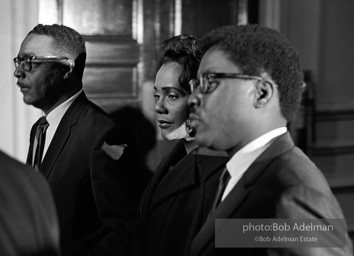 Mrs King going to view the open casket of her slain husband. Atlanta, GA. 1968