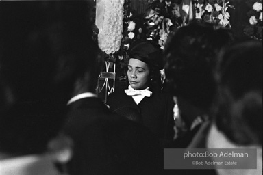 Mrs King going to view the open casket of her slain husband. Atlanta, GA. 1968