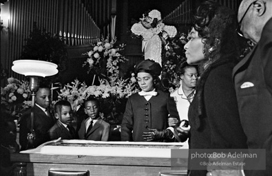 Members of King’s family, including his wife and children, view his body as it lies in state,  Atlanta, Georgia.  1968-