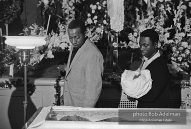 Mourners view Martin Luther King's open casket.Atlanta, GA, 1968