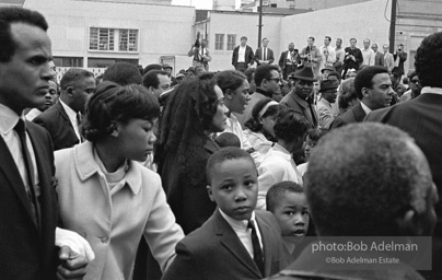 Reverand Abernathy escorts Mrs. King and Rosa Parks at memorial procession for slain Martin Luther King Jr. In front of Mrs. King are two of her sons. Memphis, TN. 1968