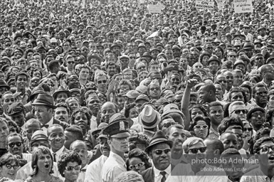 Attentive crowd listents intently as speaches begin. Washington D.C. August 28, 1963.