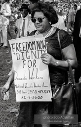 Holding a handmade sign, marcher approaches the end of the March. Washington, D.C. August 28, 1963.