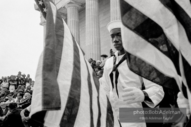 An honor guard stands at attention as King speaks.