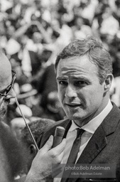 Marlon Brando, an honered guest, is interviewed on the steps of the Lincoln Memorial at the final ceremonies of the March on Washington. 1963.