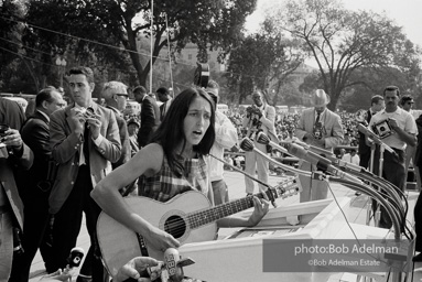 Joan Baez entertains crowd with her sonerous fold singing. August 28, 1963.