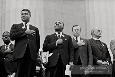 Above: Leaders including the Reverend Ralph Abernathy (far left) and National Urban League Director Whitney Young Jr. (left) join King to pledge allegiance at the beginning of the ceremony at the Lincoln Memorial, Washington,  1963