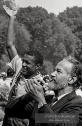 In coveralls, Jerome Smith, heroic Freedom Rider, reacts enthusiatically to King's speech.