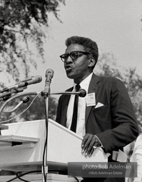 Bayard Rustin organizer of the March on Washington addresses the Marchers assembling at the Washington Monument. August 28, 1963.