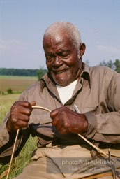 Preston Brown at work building one of his fish baskets - From the LIFE magazine story Artists of the Black Belt, 1983.