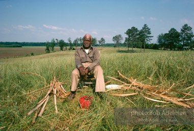 Preston Brown at work building one of his fish baskets - From the LIFE magazine story Artists of the Black Belt, 1983. Preston Brown at work building one of his fish baskets - From the LIFE magazine story Artists of the Black Belt, 1983.