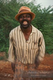 Hambone player Albert Stanton slaps his body to accompany his own lyrics about farm life.- From the LIFE magazine story Artists of the Black Belt, 1983.