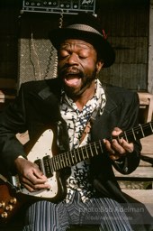 Jesse Daniels is rarely seen without his guitar. At 12, he made his first one and learned to play by watching others.- From the LIFE magazine story Artists of the Black Belt, 1983. Jesse Daniels is rarely seen without his guitar. At 12, he made his first one and learned to play by watching others.- From the LIFE magazine story Artists of the Black Belt, 1983.