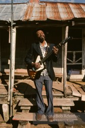 Jesse Daniels is rarely seen without his guitar. At 12, he made his first one and learned to play by watching others.- From the LIFE magazine story Artists of the Black Belt, 1983. Jesse Daniels is rarely seen without his guitar. At 12, he made his first one and learned to play by watching others.- From the LIFE magazine story Artists of the Black Belt, 1983.