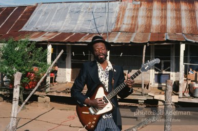 Jesse Daniels is rarely seen without his guitar. At 12, he made his first one and learned to play by watching others.- From the LIFE magazine story Artists of the Black Belt, 1983. Jesse Daniels is rarely seen without his guitar. At 12, he made his first one and learned to play by watching others.- From the LIFE magazine story Artists of the Black Belt, 1983.