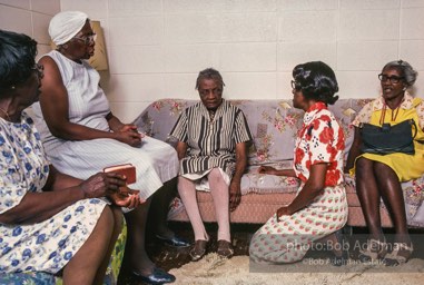 Love thy neighbor: A visiting prayer band prays with a blind parishioner, Mantua, Alabama 1983 - From the LIFE magazine story Artists of the Black Belt, 1983.