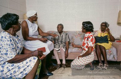 Love thy neighbor: A visiting prayer band prays with a blind parishioner, Mantua, Alabama 1983 - From the LIFE magazine story Artists of the Black Belt, 1983.