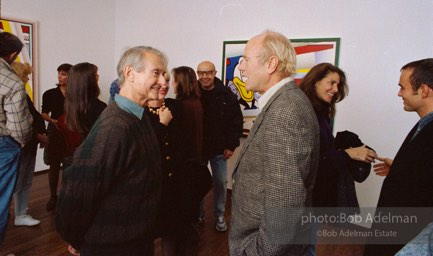 Roy Lichtenstein and James Rosenquist at the opening of Reflections. Leo Castelli Gallery, 1989. photo:©Bob Adelman Estate, Artwork©Estate of Roy Lichtenstein